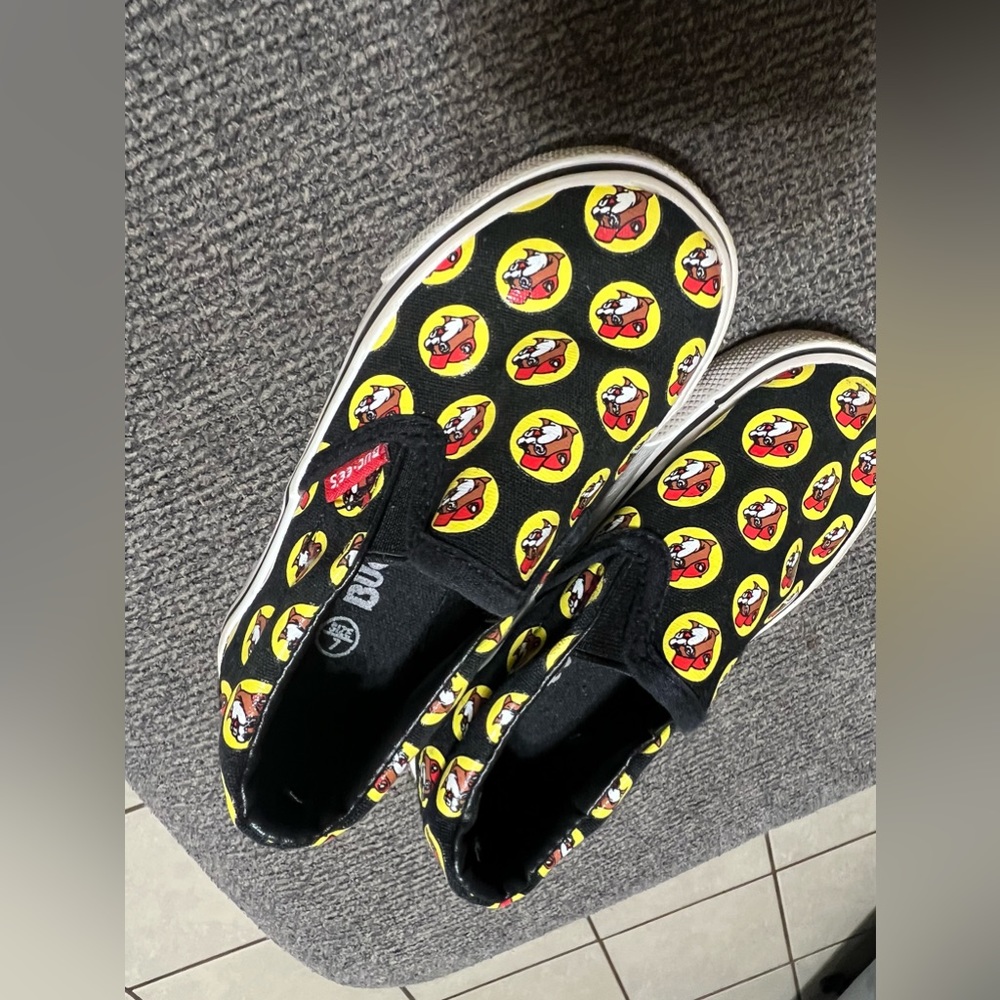Buc-ee’s shoes repeat logos.